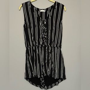 Black and white vertical striped sleeveless romper